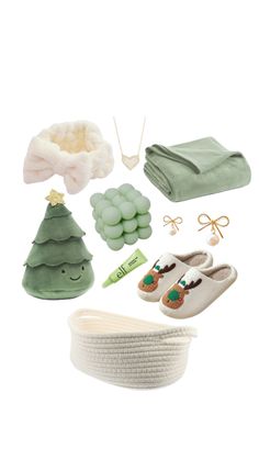 the contents of a baby's gift set including shoes, blankets and other items