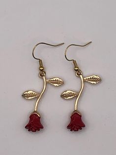 All items are handmade, so please allow for some slight variations. All earrings are mounted on fish hook closers. French Hook Drop Flower Earrings Gift, Red Flower Earrings With Ear Wire For Gift, Flower Drop Earrings With French Hook For Gift, Flower Drop Earrings With French Hook, Handmade Rose Red Earrings For Gift, Rose Red Dangle Earrings For Gift, Adjustable Red Flower Earrings With Ear Wire, Red French Hook Earrings As Gift, Red French Hook Earrings For Gift