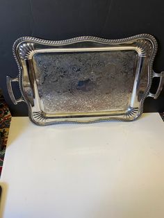 a silver tray sitting on top of a table