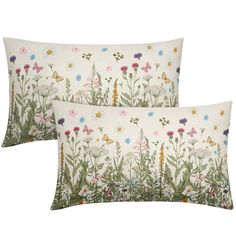 two pillows with flowers and butterflies on them