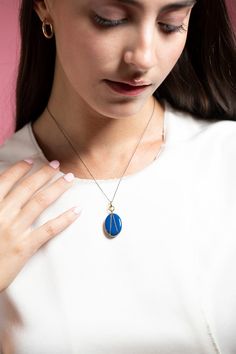 Monica Rich Kosann blue enamel vermeil oval locket necklace. What's your story? Tell it in color. Give your story style with our Blue Enamel Gold Vermeil Oval Locket. Perfect on its own or layered with your other favorite pieces. Locket holds two images. Locket Measures 15/16" Tall by 11/16" Wide. 17" Black Steel Chain, with a loop at 16" for adjustability and a complimentary 18" Blue Cord to create a second look. 18k Yellow Gold Vermeil over Sterling Silver Monica Rich Kosann Jewelry, Oval Locket Necklace, Monica Rich Kosann, 17 Black, Oval Locket, Fine Jewels, Gold Enamel, Locket Necklace, Black Steel