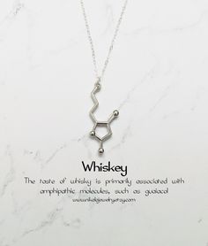 Molecule necklaces were featured on Buzzfeed and BUST magazine Whiskey Molecule Necklace in Silver The taste of whisky is primarily associated with amphipathic molecules, such as guaiacol, but why and how dilution enhances the taste is not well understood. Purchase includes a molecule information card, a natural jewelry box, and gift packaging. Gift? Add-on a hummingbird card for only $7: https://www.etsy.com/listing/202506976/nikola-jewelry-hummingbird-card Add-on extender: https://www.etsy.com Hummingbird Card, Chemistry Necklace, Molecule Art, Chemistry Jewelry, Doctor Logos, Molecule Necklace, Keychain Leather, Science Jewelry, Medical Jewelry