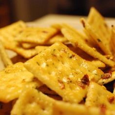 some cheesy crackers are sitting on a plate