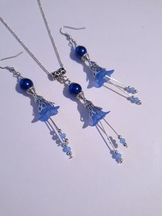 blue pearl Victorian Silver flower jewelry set cobalt blue flower set necklace earrings blue flower jewelry set blue  crystal Boho Silver set gift Gorgeous  Victorian style jewelry set necklace and earrings . Bohemian necklace and earrings . Beautiful Set of silver-tone Antique style ornaments and cobalt blue crystal pearls and blue plastic flowers with little fine blue crystals necklace and earrings. Silver-tone Victorian style necklace and earrings. Boho necklace. Bohemian necklace and earrings. Romantic necklace and earrings. Royal style jewelry set. Baroque style jewelry set. Antique style jewelry set. Gothic style jewelry set.  Perfect Gift for girlfriend,  mother,  sister,  bridesmaids or Maid of honor. Gift for special people or jewelry set for your special occasion. FREE SHIPPING Nickel Free Czech Glass Wedding Jewelry, Sapphire Flower Jewelry For Gifts, Handmade Blue Jewelry Sets For Gifting, Blue Dangle Jewelry With Matching Earrings, Handmade Blue Jewelry Sets As Gift, Adjustable Blue Flower Necklace For A Gift, Blue Beaded Flower Necklace As Gift, Blue Pendant Jewelry With Matching Earrings, Elegant Blue Handmade Jewelry Sets