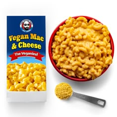 a bowl of macaroni and cheese next to a carton of macaroni and cheese