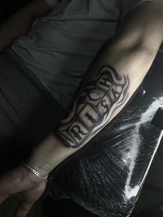 a person with a tattoo on their arm