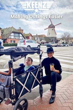 A child inside a Keenz 7S 2.0 2-Passenger Stroller Wagon with a woman crouching next to the stroller. Keenz. Making outings easier.