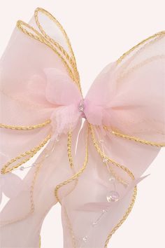 Please note that this item is final sale and cannot be returned or exchanged. See more in our Shipping and Returns page. 1pc This dainty pink bow clamp will make any outfit fairytale-like. The trailing ribbons are accompanied by strings of tiny butterflies and dew drop pearls that gently drape down, adding a soft and fun touch to your look. Composition 70% Polyester, 15% Acetate beads, 15% Iron Rhodium Plate 5" x 14" x 1" Made with love in South Korea Adjustable Pink Bow For Party, Pink Satin Wedding Bow, Whimsical Pink Hair Accessories, Adjustable Pink Bow For Wedding, Elegant Pink Ribbon Hair Accessories, Elegant Pink Hair Accessories With Ribbon, Pink Decorative Bow Hair Accessories For Wedding, Pink Hair Accessories With Decorative Bow For Wedding, Pink Satin Bow Hair Accessories For Wedding