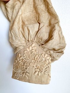 The most glorious antique ecru silk blouse. High neck, puff shoulder, lace at cuffs and chest, delicate pin tucks at front and back. So many good details and such structure. Fabric: Silk & laceFit: XS Measurements: Bust 30” Shoulders 12.5” Sleeve 20”Waist 24” Arm opening (flat) 7” Neck 12.5” Condition: Good. As found antique. Pin Tucks, Lace Blouse, Silk Blouse, Bride Dress, Silk, Lace, Fabric