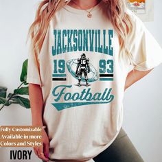 Comfort Colors Vintage Jacksonville Football shirt * Jacksonville Football Sweatshirt * Vintage Retro Style Jacksonville Football Tee* MC466 We create custom sweatshirts with great designs for everyone's liking. If you don't find the size or color you would like, please message us and we will be happy to accommodate! PRODUCT We use the finest premium Comfort Colors® 1566 crew-neck Garment-Dyed Sweatshirt & Comfort Colors® 1717 Garment-Dyed T-shirt, they are feather soft and very breathable with Affordable Vintage T-shirts For Sports Season, Football Season Custom Print Crew Neck T-shirt, Custom Print Crew Neck Fan Gear Top, Custom Print Crew Neck Top For Fan Gear, Fan Apparel Short Sleeve Graphic Sweatshirt, Crew Neck Top With Custom Print For Fan Apparel, Long Sleeve Custom Print T-shirt For Sports, Custom Print Long Sleeve T-shirt For Sports Season, Dyed Sweatshirt