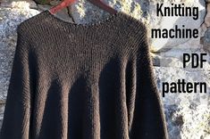 a knitted sweater hanging on a clothes line with the text knitting machine pattern below it