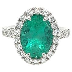 Certified Oval Colombian Emerald weighing 3.68 carats Measuring (11.92x8.90x6.50) mm Diamonds weighing .98 carats G-SI1 Set in 18 karat white gold ring 6.58 g Diamond Halo Ring, Colombian Emeralds, Halo Diamond Ring, I Love Jewelry, White Gold Ring, Halo Ring, Halo Rings, Diamond Halo, Emerald Diamond