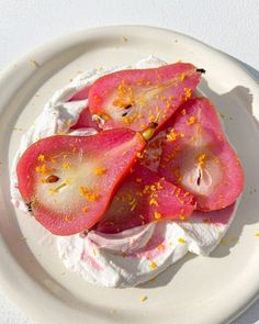 a white plate topped with food on top of a table