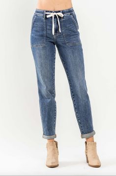 Judy Blue Medium Wash Cuffed Denim Joggers  94% Cotton, 5% Polyester, 1% SpandexRise: 11"Inseam: 28" Cuffed, 30" Uncuffed Want to view this on the *Live* Sizing & Styling Guide?! Watch it in the photo section above or... Relaxed Fit Denim Jeans With Cuffed Ankles, Cuffed Ankle Denim Bottoms For Fall, Denim Bottoms With Cuffed Ankles For Fall, Fall Denim Bottoms With Cuffed Ankles, Medium Wash Relaxed Fit Jeans With Cuffed Ankles, Medium Wash Denim Bottoms With Cuffed Ankles, Blue Denim Bottoms With Cuffed Ankles, Casual Relaxed Fit Jeans With Cuffed Ankles, Casual Denim Jeans With Cuffed Ankles