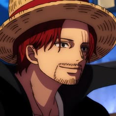 a man with red hair wearing a straw hat