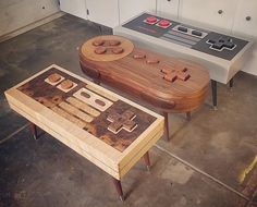 two wooden tables with game controllers on them