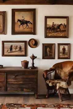 a living room filled with furniture and pictures on the wall