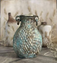 ⚱⚱ Part of our Harvest collection, the large textured pottery vase is painted with a special technique in bronze, gold and green tones. The handmade ceramic vase combines elegance and rustic charm with its textured design. With its textured and wide form, this vase is perfect for adding a statement piece to your home. Its antique-looking design and wabi-sabi aesthetic make it a versatile decor option for both cottage style and modern homes. 🌾 Antique Rustic Finish: A striking bronze patina give Tall Ceramic Vases Pottery, Wabi Sabi Floor, Rustic Wabi Sabi, Wabi Sabi Vase, Textured Pottery, Indian Ceramics, Sabi Aesthetic, Fall Tabletop Decor, Wabi Sabi Aesthetic