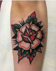 a rose tattoo on the arm and leg