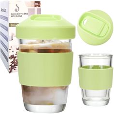 a glass cup with ice in it next to a green lid and plastic straw holder