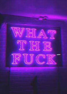 a neon sign that says, what the f k?