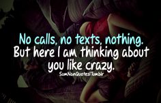 a woman laying on top of a bed with the caption, no calls, texts nothing but here i am thinking about you like crazy