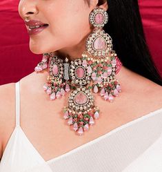 Pink Polki Necklace Sabyasachi Jewelry Set, inspired by Victorian designs from India. The Kundan Jewelry and Victorian Polki Choker showcase intricate craftsmanship. This exquisite ensemble exudes opulence and elegance, reflecting the timeless allure of Indian jewelry. Celebrate any special occasion with this captivating Kundan Choker, a perfect blend of tradition and luxury, making you shine like a true queen. *𝐏𝐑𝐎𝐃𝐔𝐂𝐓 𝐃𝐄𝐓𝐀𝐈𝐋* * Material: Brass * Plating: Gold Plated * Stone: Semi Traditional Luxury Kundan Choker Necklace, Luxury Pink Kundan Necklace In Elegant Style, Polki Diamond Necklace, Polki Sets, Sabyasachi Jewelry, Polki Choker, Jewelry Kundan, Sabyasachi Jewellery, Jewelry Victorian