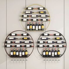 two circular metal shelves with wine bottles on them