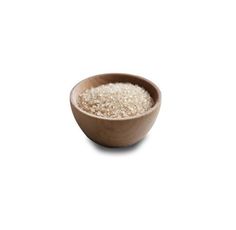 a wooden bowl filled with rice on top of a white table