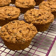 several muffins cooling on a wire rack