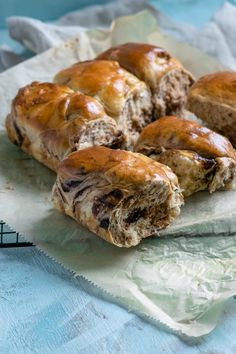 several pastries sitting on top of a piece of paper