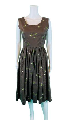 A vintage 1950s novelty, cotton, sleeveless dress, with a fun lightening bug/firefly print perfect for wearing to a summer BBQ or an evening date! Color is best described as a gray toned dark green that reads as brown with a chalk like bug print in blue/white/yellow/red/green. Closes with side metal zipper. LABEL: - FABRIC: feels like cotton SHOULDERS: 15" BUST: 35" WAIST: 27" SHOULDER TO WAIST: 15" SWEEP: 49.5" undoubled LENGTH: 42" CONDITION: great, has light discoloration at underarms PINNED TO MODEL?: no ☝For reference Mod's measurements are S 11", B 32.5", W 24", H 32.5"☝ [1-1411] Shop more vintage from my personal closet  https://www.etsy.com/shop/StorylandVintage?search_query=meg+darling ♪ We love to wear vintage all the time, vintage all the time, vintage all the timeee ♪ https://w A-line Cotton Vintage Dress For Party, Cotton A-line Vintage Dress For Party, Summer Party Cotton Vintage Dress, Summer Party Vintage Cotton Dress, Mid-century Summer Party Dresses, Mid-century Cotton Summer Dress, Mid-century Sleeveless Cotton Dress, Bug Dress, Vintage 1950s Sleeveless Floral Print Dress