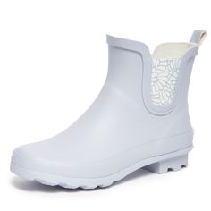 PRICES MAY VARY. Stay Dry in Style: Laura Ashley ladies mid cut ankle height rubber rain boots offer both fashion and function. Keep your feet dry and stylishly protected from the elements with these chic waterproof booties, perfect for rainy days or outdoor activities. Comfortable All-Day Wear: Designed for comfort, these rain boots feature a cushioned insole and fabric lining to keep your feet cozy and supported, even on the longest of rainy days. The round toe and wide cuffs ensure a comforta Chelsea Cut, Booties For Women, Short Rain Boots, Rainy Weather, Wide Cuff, Laura Ashley, Lug Sole, Versatile Style, Rainy Days