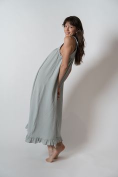 Slip into something more comfortable! Made from a lightweight and breathable combed cotton, you can wear this day or night. Detailed with contrast scalloped edges, a seam at the top of the bust and adjustable shoulder straps for comfort and ease. Bring this with you to the beach, layer over your favorite tee or wear as the softest sleep dress. A true staple to add to your collection. Features Relaxed silhouette slip dress Adjustable shoulder ties Scalloped trim along edges Seam at top of bust Pl Spring Lounging Dresses With Spaghetti Straps, Sleeveless Ruffled Slip Dress For Daywear, Cotton Lounge Dress For Spring, Spring Cotton Dresses For Lounging, Cotton Dresses For Lounging In Spring, Spring Cotton Slip Dress For Loungewear, Casual Lounging Dress With Spaghetti Straps, Spring Sleeveless Lounging Dresses, Flowy Slip Dress For Daywear