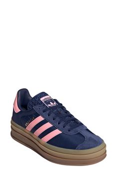 A triple-stacked platform elevates a time-tested sneaker, while serrated side stripes keep it close to its roots. Lace-up style Removable insole Leather upper/synthetic and textile lining/synthetic sole Imported Trendy Shoes For Women Sneakers, Platform Gazelle, Cute Platform Shoes, Blue Gazelle, Adidas Bold, Pink Gazelles, Pink Adidas Shoes, Adidas Gazelle Bold, Navy Adidas