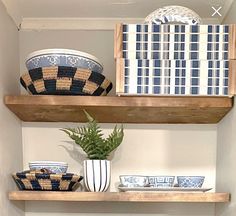 some shelves with bowls and plates on them