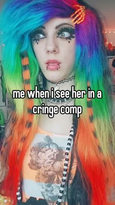 a girl with colorful hair and piercings on her face is looking at the camera