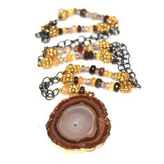 "This agate necklace is a gorgeous combination of sparkling black and gold. A gold dipped agate slice is paired with natural black and white Ethiopian opal and shimmery zircon with gold vermeil accents. This necklace is adjustable to approximately 20.5\". Gorgeous! FizzCandy, in association with The Artisan Group®, participated in GBK's invitation-only luxury celebrity gift lounge honoring the nominees and presenters for the 2017 Golden Globes. The gift lounge took place on January 6-7, 2017 in Black Opal Necklace, Golden Globes 2017, Stacking Necklace, Agate Slice Necklace, Raw Opal Ring, Jewelry Stacking, Grey Diamond Ring, Necklace Everyday, Druzy Jewelry