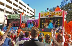 a parade with people dressed in costumes and clowns