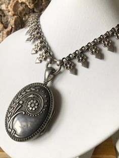 A Stunning antique Victorian collar and locket , Sterling Silver, a wonderful oval locket from the 1880s , untouched original patina with Art Nouveau influences, Hallmarked in Chester 1882 , 59mm high including the bale 33mm wide, some age related wear and an odd ding to the reverse, on a wonderful Victorian collar, 43cm long , the locket can be detached from the collar and the pieces could be worn separately, I have deliberately left the collar and locket in there original condition with no polishing etc Vintage Etched Oval Pendant Locket Necklace, Victorian Antique Silver Oval Necklace, Victorian Oval Necklace In Antique Silver, Antique Silver Hallmarked Locket Necklace, Victorian Oval Necklaces With Antique Finish, Victorian Oval Necklace With Antique Finish, Vintage Oval Engraved Locket Necklace, Vintage Engraved Oval Pendant Locket Necklace, Vintage Engraved Oval Locket Necklace