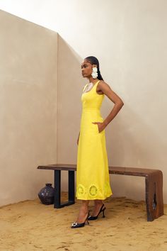 Elevate your summer style with our Kwara Dress. Hand-crafted by artists in Nigeria, this sundress features stunning crochet details along the hem. With a square neck and sleeveless design, this 100% cotton dress is perfect for your next weekend getaway. Stay cool and stylish with this must-have piece with pockets. Dry clean only Size up if in between sizes Colour may vary due to lighting on images Bohemian Cotton Dress With Cutwork Hem, Summer Midi Dress With Cutwork Hem, Summer Maxi Dress With Cutwork Hem, Sleeveless Dress With Crochet Trim For Vacation, Sleeveless Crochet Trim Dress For Vacation, Summer Style Cotton Crochet Dress, Midi Length Dresses With Cutwork Hem For Vacation, Sleeveless Cotton Dress With Crochet Trim, Sleeveless Maxi Dress With Crochet Trim