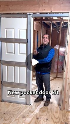 a man standing in front of an open door with the words new pocket door kit on it