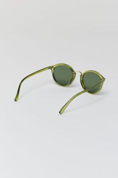 Round silhouette sunglasses with a plastic frame. Features a metal nose piece and temple accents. Fitted with tinted UV-blocking lenses. Features Plastic frame sunglasses Metal accents Tinted UV-blocking lenses Content + Care Polycarbonate, metal Wipe clean Imported Size Bridge: 20mm Width: 50mm Height: 46mm | Myrtle Round Sunglasses in Dark Green, Men's at Urban Outfitters Trendy Urban Outfitters Sunglasses With Uv Protection, Green Tinted Glass Sunglasses, Modern Urban Outfitters Sunglasses With Gradient Lenses, Urban Outfitters Modern Mirrored Sunglasses, Green Wayfarer Sunglasses With Tinted Lenses, Green Polarized Glass Sunglasses, Green Sunglasses With Gradient Lenses And Round Frame, Round Frame Sunglasses With Tinted Glass Lenses, Green Round Frame Sunglasses With Gradient Lenses