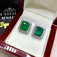 "BRAND-NEW!! ONE OF A KIND, HANDCRAFTED EARRINGS. So Perfect Jewelry proudly presents!! Delicately handcrafted, EXQUISITE EMERALD EARRINGS! With two matching HUGE NATURAL Emeralds! TOP VIVID GREEN COLOR AND FULL TRANSPARENCY with few minor inclusions. Accented with superb quality, natural diamonds, set in handcrafted 18K solid white gold earrings. Classy and simple, elegant and charming, with vivacious Green COLOR, and sparkling diamonds, these earrings sure make a lady feel like a princess! \"Y Luxury Diamond Earrings With Halo Setting, Platinum Earrings With Halo Design For Gift, Platinum Halo Design Earrings For Gift, Platinum Diamond Earrings With Halo Design As Gift, Emerald Cut Halo Setting Earrings For Wedding, Emerald Cut Halo Setting Wedding Earrings, Emerald Cut Earrings With Halo Setting For Anniversary, 14k White Gold Halo Diamond Earrings For Gift, Emerald Cut Halo Setting Earrings For Anniversary