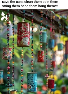 colorful tin can wind chimes hanging from a tree branch with butterflies on them and the caption says, save the cans clean them pain then