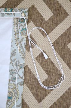 a piece of fabric with some white wires attached to it