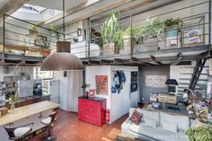 a loft apartment with an open floor plan