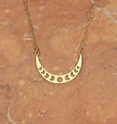 Moon phases necklace, crescent moon, moon jewelry, astrology, waxing moon, crescent necklace A 14k gold vermeil moon phase charm hanging happily from a 14k gold vermeil chain in the length of your choice! This beauty measures Looking for other charm necklaces? https://www.etsy.com/shop/BubuRuby?section_id=12318467 More from Bubu Ruby? https://www.etsy.com/shop/BubuRuby?ref=si_shop ♥ Handmade with love in sunny California ♥ These gems will arrive happily in a gift pouch or box Nickel Free Crescent Celestial Jewelry, Celestial Half Moon Gold Jewelry, Gold Necklaces With Sun And Moon Design, Crescent Moon Print Jewelry As A Gift, Gold Necklaces With Sun And Moon Half Moon Design, Dainty Crescent Nickel-free Jewelry, Adjustable Crescent Nickel Free Necklace, Spiritual Crescent Jewelry With Adjustable Chain, Dainty Crescent Moon Phase Jewelry