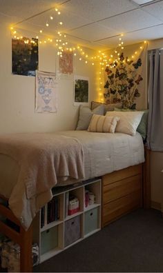 a bedroom with lights strung from the ceiling