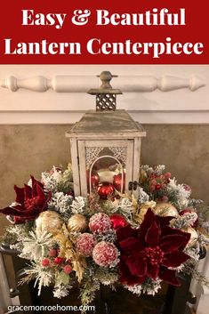 a christmas centerpiece with poinsettias and other holiday decorations